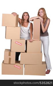 Girls surrounded by boxes