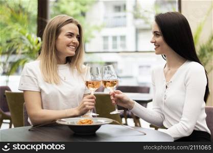 girls toasting with rose wine