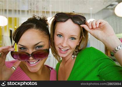 Girls Trying on Sunglasses in Boutique