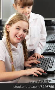 Girls using computers in school class