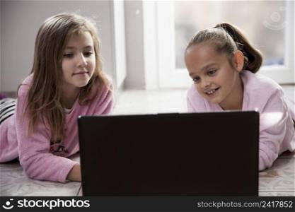 girls watching movie laptop