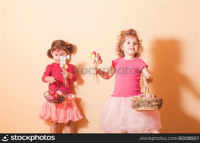 Girls with baskets on the Easter Egg hunt. Girls on an Easter Egg hunt