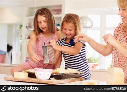 Girls With Mother Making Cheese On Toast