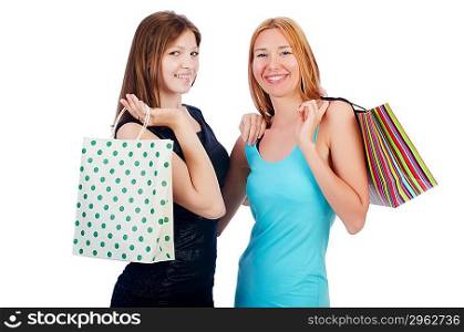 Girls with shopping bags on white