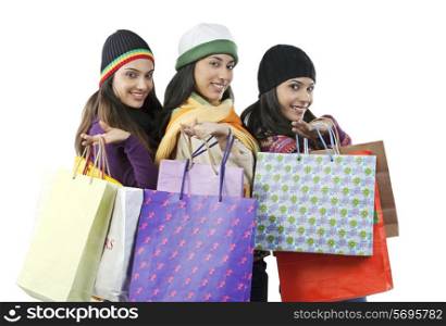 Girls with shopping bags posing