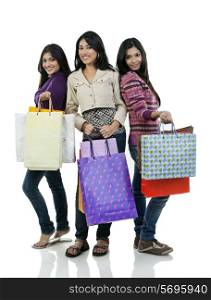 Girls with shopping bags posing