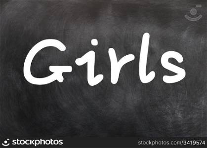 Girls - word written in white chalk on a blackboard