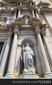 Girona cathedral facade with statues in a beautiful summer day, Catalonia, Spain
