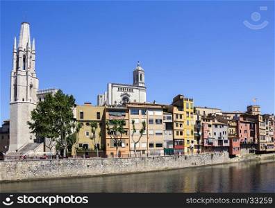 Girona picturesque small town with Colorful houses and ancient Church of Sant Feliu and Saint Mary Cathedral