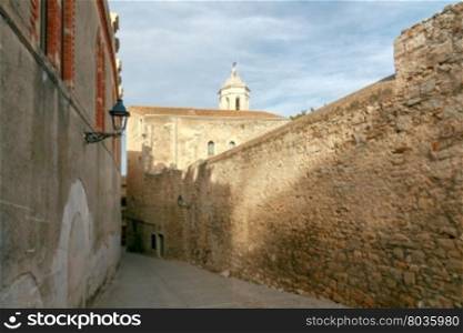 Girona. The traditional city street.. Ancient medieval narrow street in Girona. Spain. Catalonia.