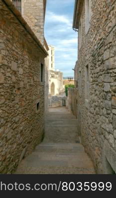 Girona. The traditional city street.. Ancient medieval narrow street in Girona. Spain. Catalonia.