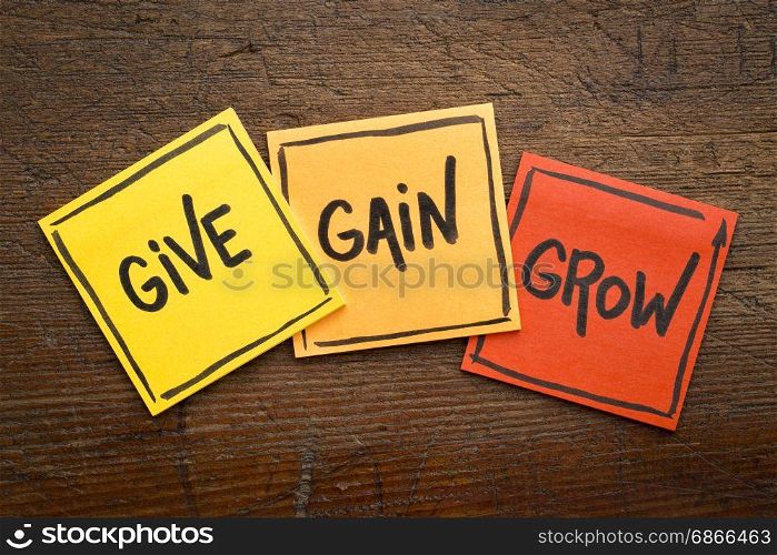 give, gain and grow word abstract - personal development concept, handwriting on sticky notes against rustic wood