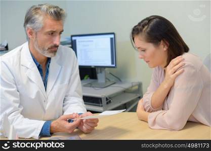giving a prescription to the patient