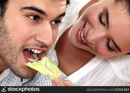 Giving her boyfriend a salad