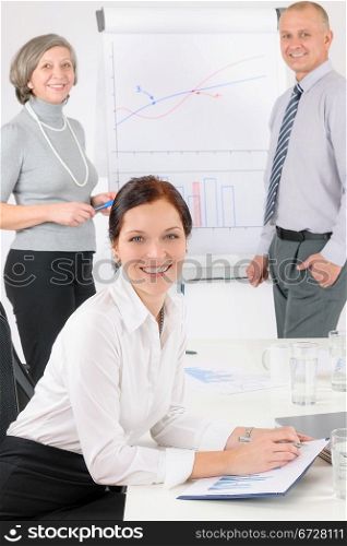 Giving presentation young executive during meeting woman review charts