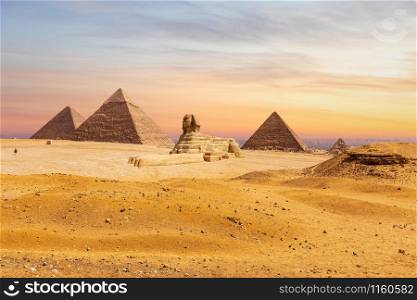 Giza desert, view on the Great Sphinx and the Pyramids, Egypt.. Giza desert, view on the Great Sphinx and the Pyramids, Egypt