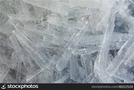 Glacial block of ice with interesting structure crystals macro. Winter background.