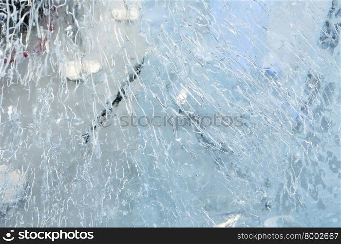 Glacial transparent block of ice with interesting drawings and patterns
