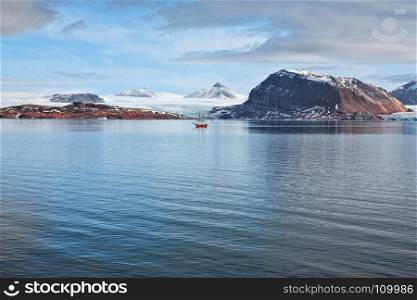 Glacier and mountains in Svalbard islands and sailing ship, Norway. Glacier and mountains in Svalbard islands, Norway
