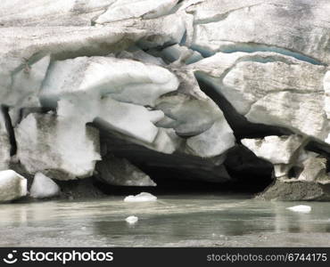 glacier mouth. mouth of a glacier in the alps, the place where water comes out of the glacier