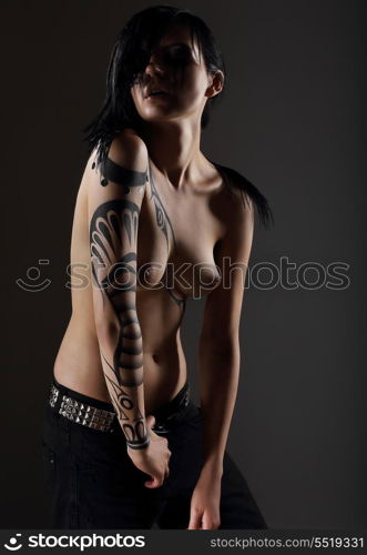 Glam. Sexy Nude Punk with Fantastic Tattoo on her Hand. Naked Hipster