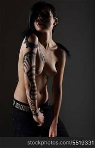 Glam. Sexy Nude Punk with Fantastic Tattoo on her Hand. Naked Hipster