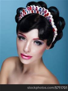 Glamor. Beautiful Brunette in Crown with Jewels