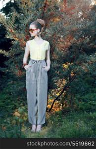 Glamor. Trendy Stylish Fashion Model in Elegant Pants Outdoors