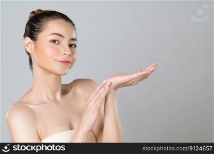 Glamorous beautiful woman with perfect smooth pure clean skincare with soft makeup in isolated background. Beauty hand gesture with expressive facial expression for advertising and indicate promotion.. Glamorous beautiful woman with perfect smooth and clean skin.