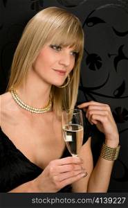 Glamorous blond woman party dress drink champagne glass looking aside