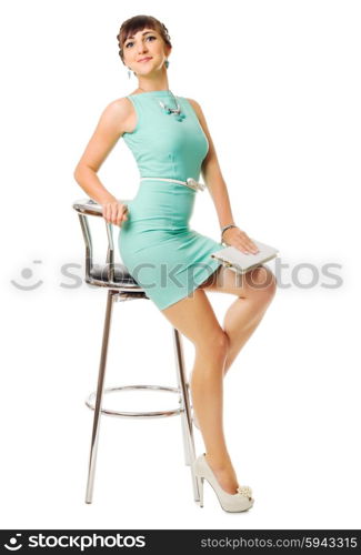 Glamorous girl in turquoise dress and chair isolated