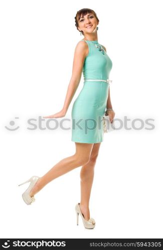 Glamorous girl in turquoise dress with handbag isolated