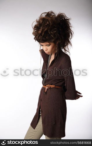 Glamorous Woman in Brown Jacket Looking Down