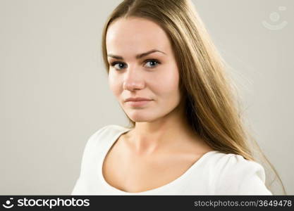 glamorous young woman in a white blouse