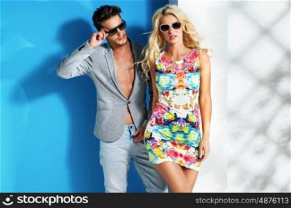 Glamour couple wearing trendy summer clothes