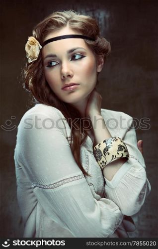 Glamour hippie girl posing on grunge background