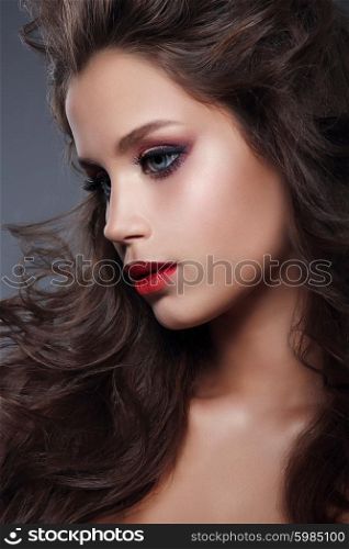 Glamour portrait of beautiful woman model with makeup, profile. Studio portrait.