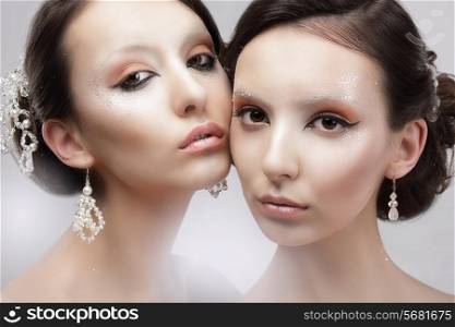 Glamour. Portrait of Two Women with Shiny Glossy Makeup