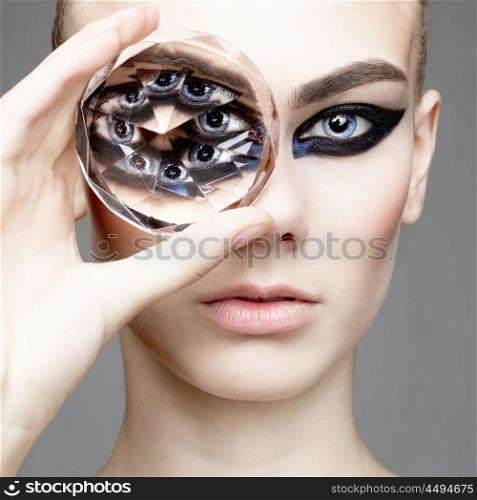 Glamour portrait of young beautiful woman with big diamond