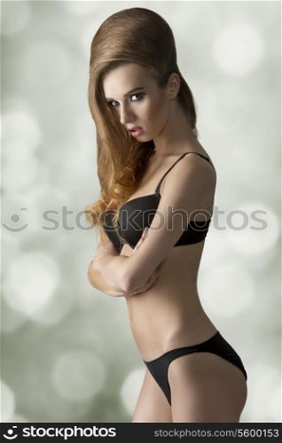 glamour shot of sexy girl with black lingerie and volume cute hair-style