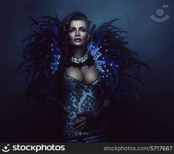 glamour woman with dark feathers