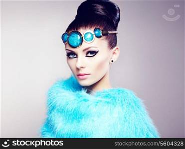 Glamour women in fur cape. Fashion photo
