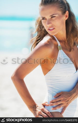 Glamour young woman posing on beach