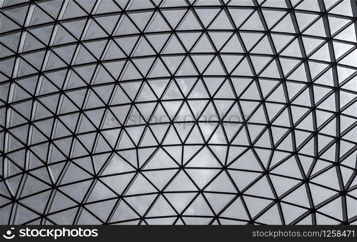 Glass and steel building with triangle pattern structure. Futuristic architecture. Neo-futurism architectural style. White triangle geometric dome texture. Creative art design of modern building.