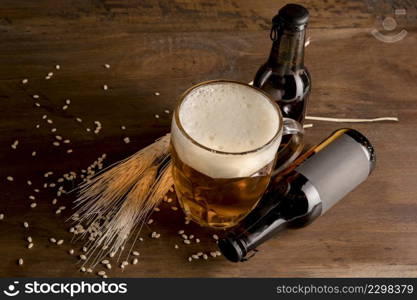 glass beer with brown bottles beer wooden table