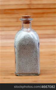 Glass bottle filled with sand from the beach