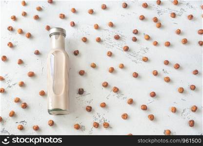Glass bottle of hazelnut milk: top view