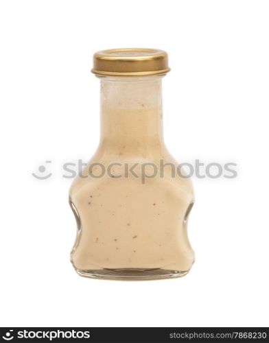 Glass bottle of white sauce. Isolated on white background