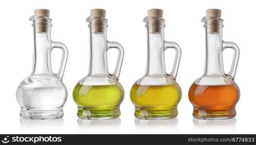 Glass Bottles Of Oil And Vinegar On White Background