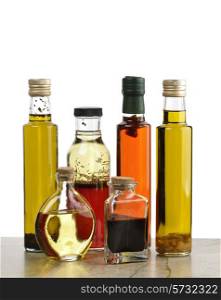 Glass Bottles Of Olive Oil,Salad Dressing And Vinegar
